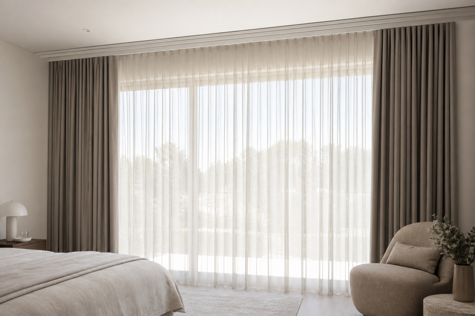 Layered sheer and blockout double curtains on a double track in a neutral living room